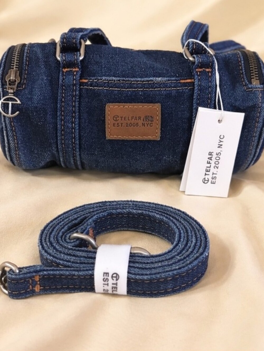 Telfar Medium Denim Barrel Bag in Dark Blue with Brown Leather Patch